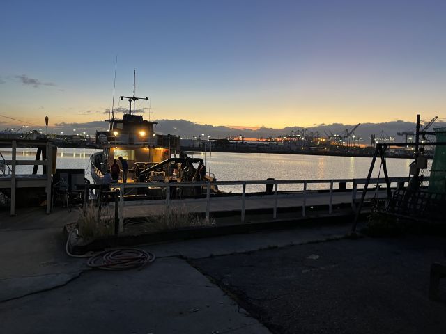 A research boat at sunset